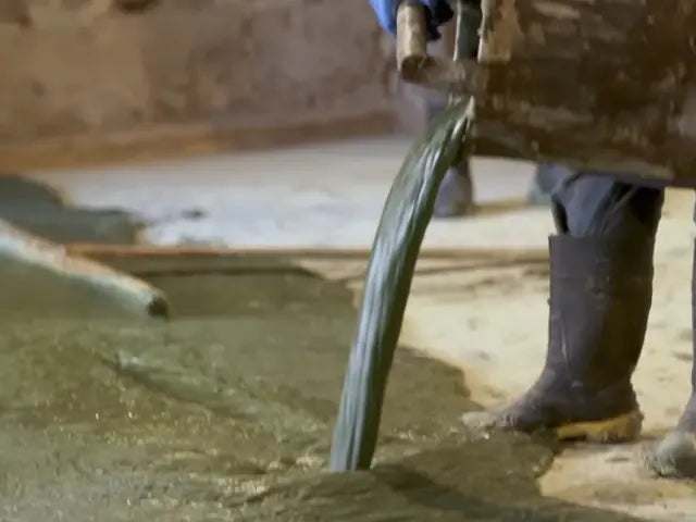 Hot liquid soap being poured across the workshop floor